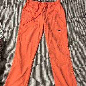 Koi lite - 5 pocket drawstring waist slim fit stretch scrub pants. Color: Coral